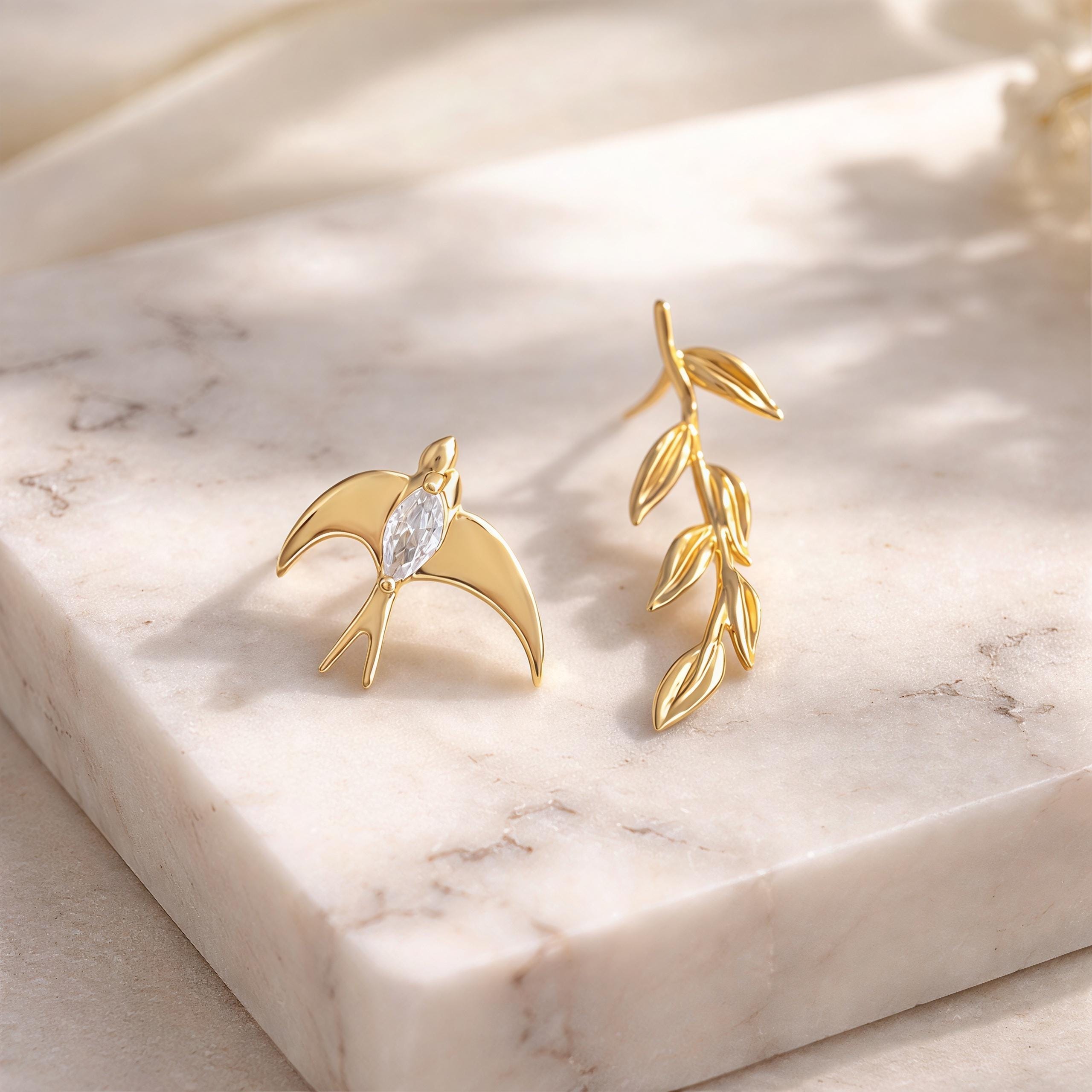 Asymmetrical Swallow & Olive Branch Earrings – 18K Gold Plated Bird Earrings with CZ